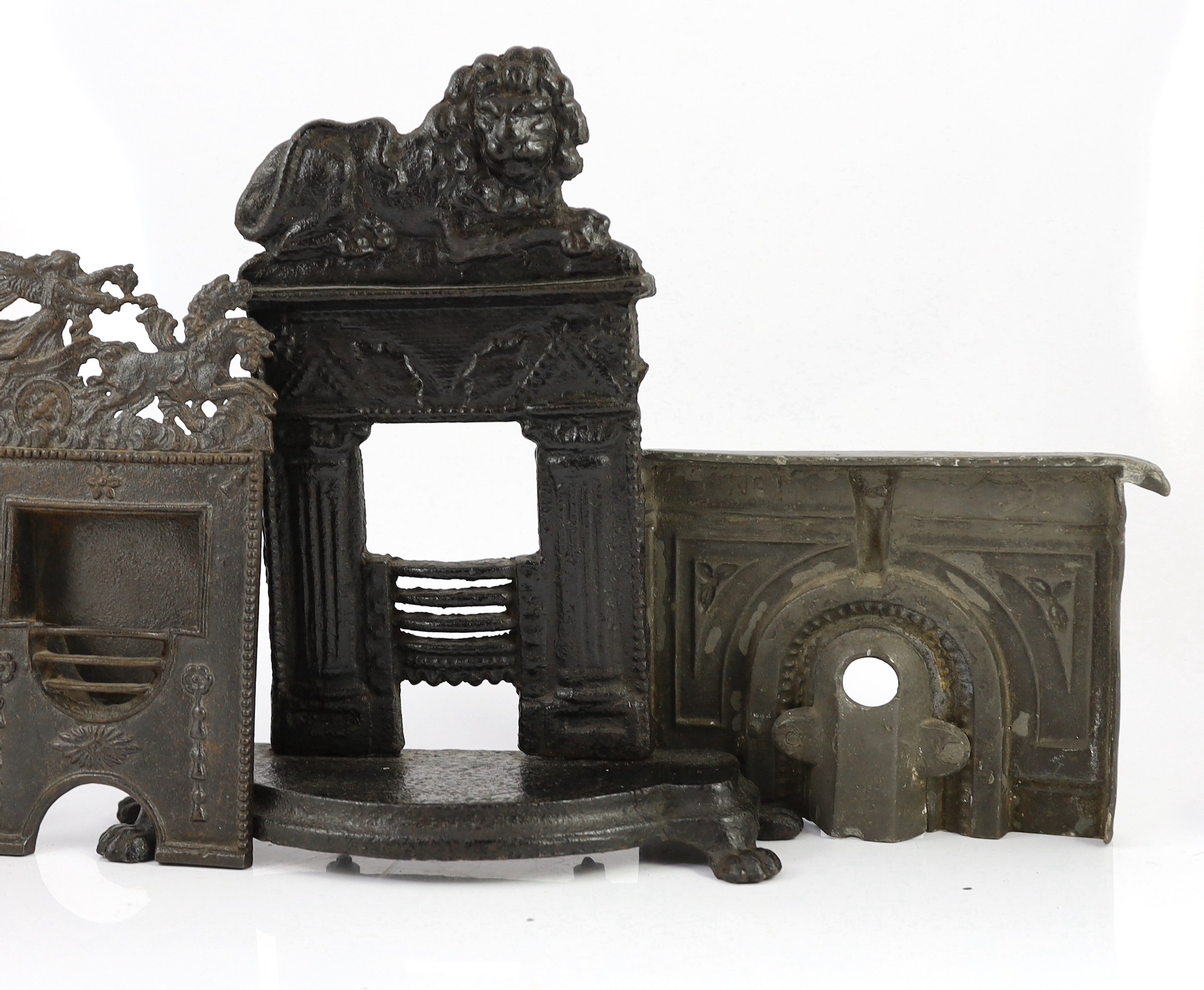 Four 19th century cast iron fire grate models, largest 12in. high